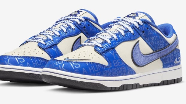 Side view of blue and white Nike Dunk sneakers.